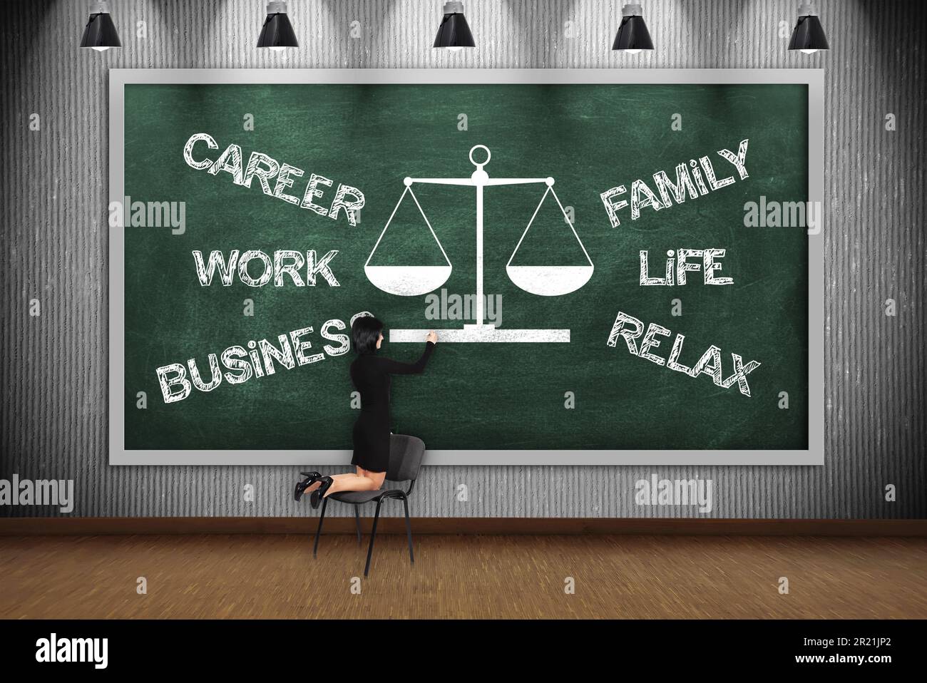 businesswoman drawing choose between career and family on green blackboard Stock Photo