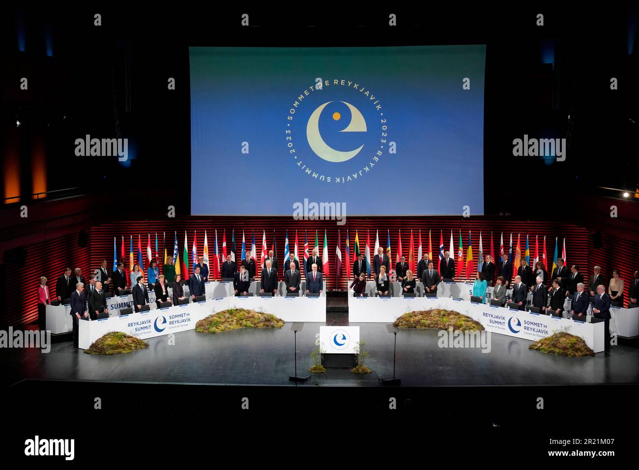 Heads of state and government stand during the opening of the Council