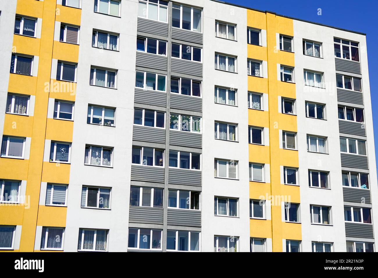 Curated visual reference: Renovated And Insulated Multistorey Apartment Building Against A Blue Photo Inspiration