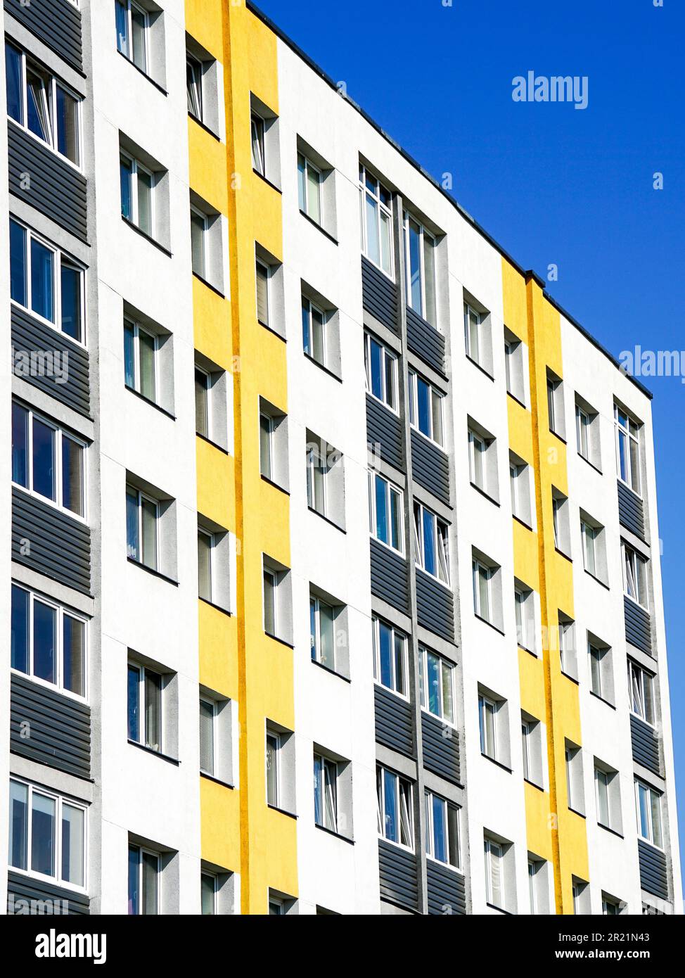 Photo inspiration: Picture Idea: Renovated And Insulated Multistorey Apartment Building Against A Blue
