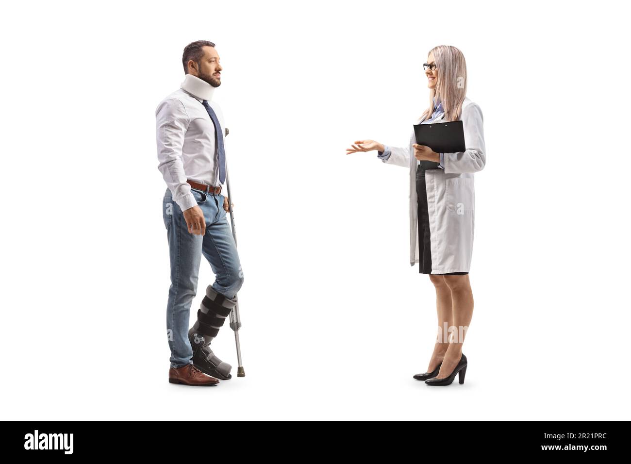 Female doctor talking to an injured man with an orthopedic boot and cervical collar isolated on white background Stock Photo