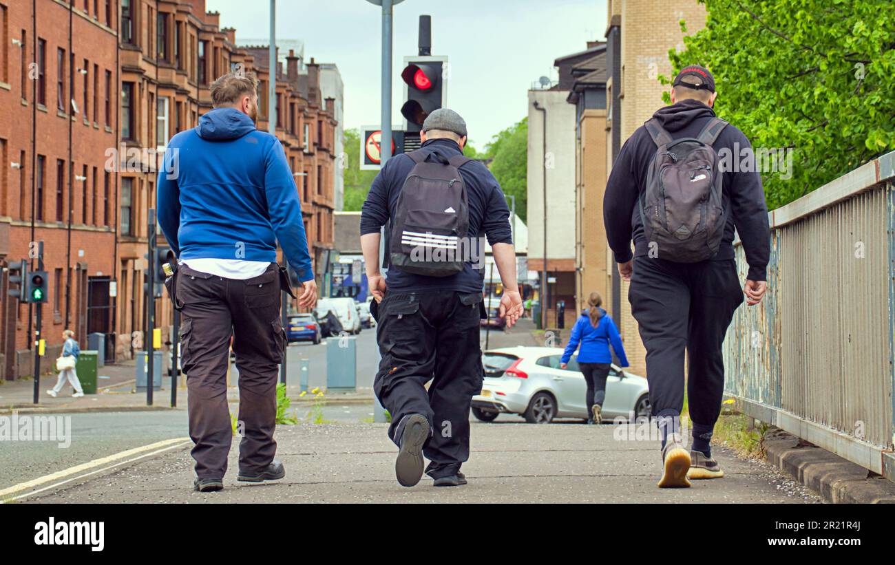 students  in partick enjoy the calm weather out and about their business on the street Stock Photo