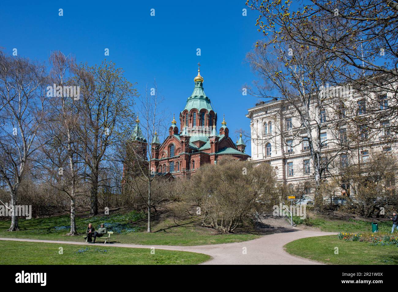 Tove Jansson Park and Uspenski Cathedral against clear blue sky on a sunny spring in Katajanokka district of Helsinki, Finland Stock Photo