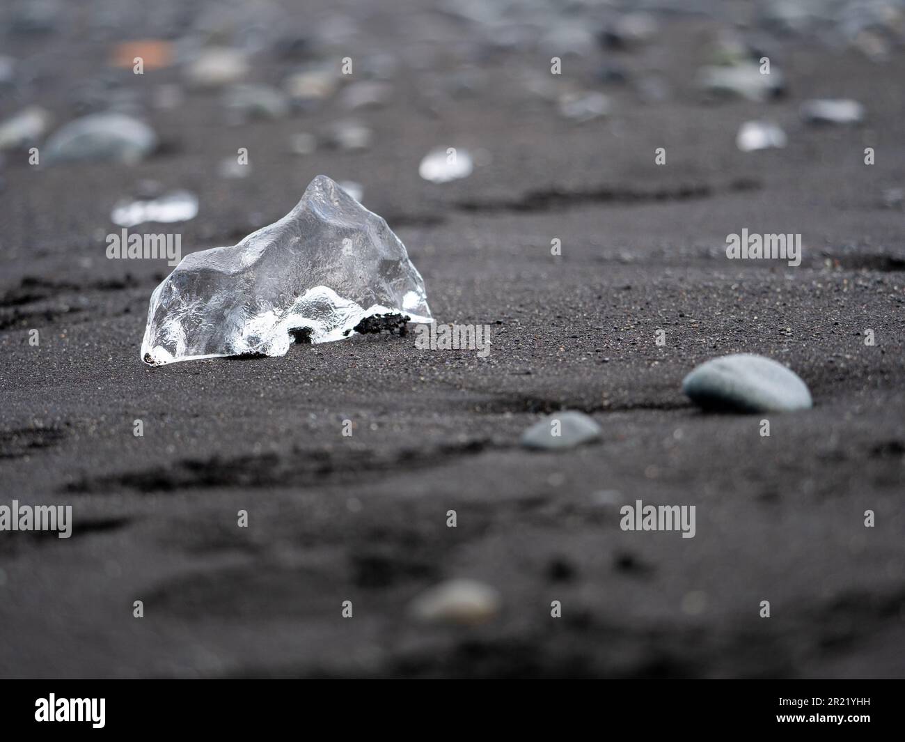 An iceberg lying on a sandy Diamond beach Stock Photo - Alamy