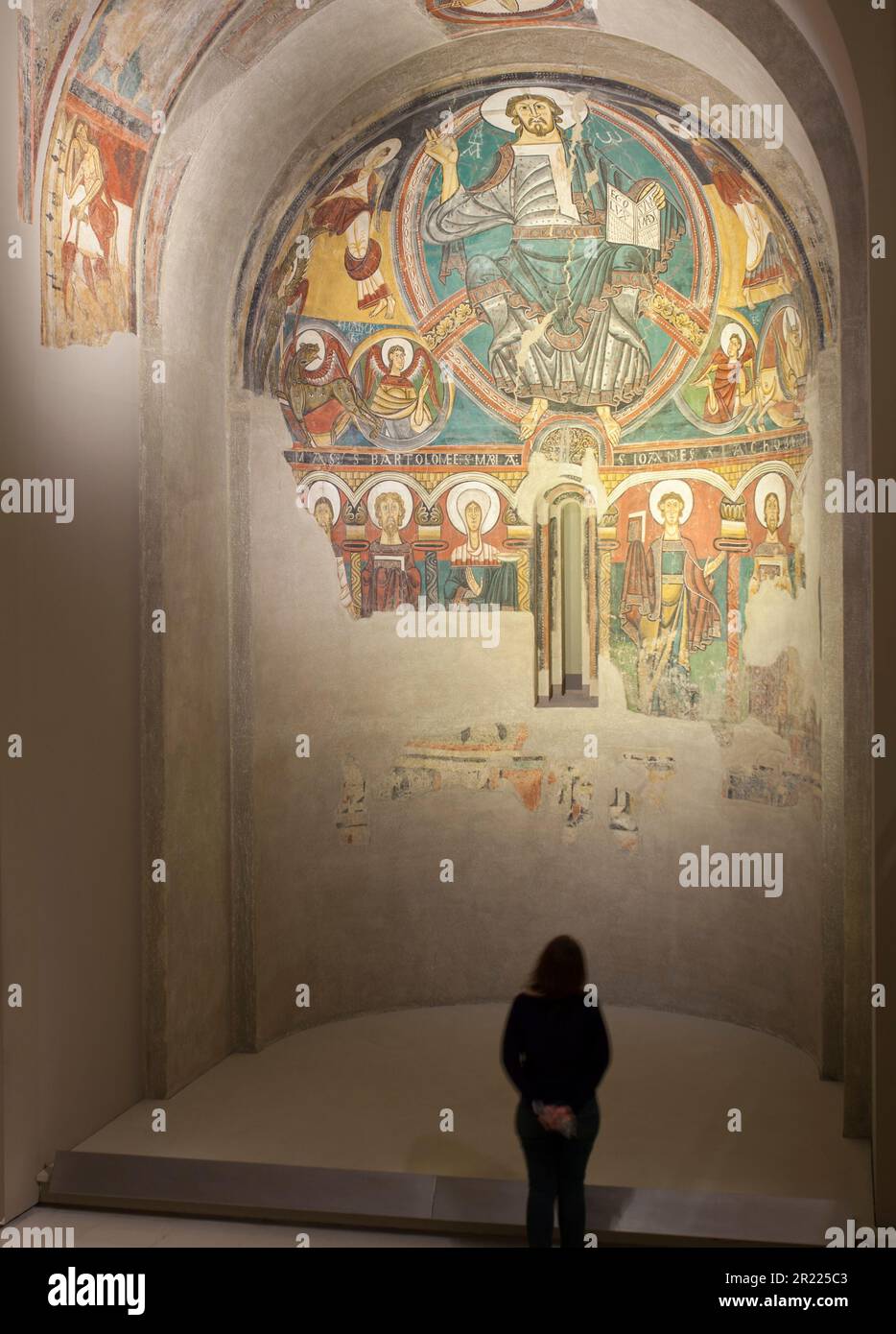 Barcelona, Spain - Dec 26th 2019: Visitor woman observing apse of Sant Climent de Taull at National Art Museum of Catalonia, Barcelona, Spain Stock Photo