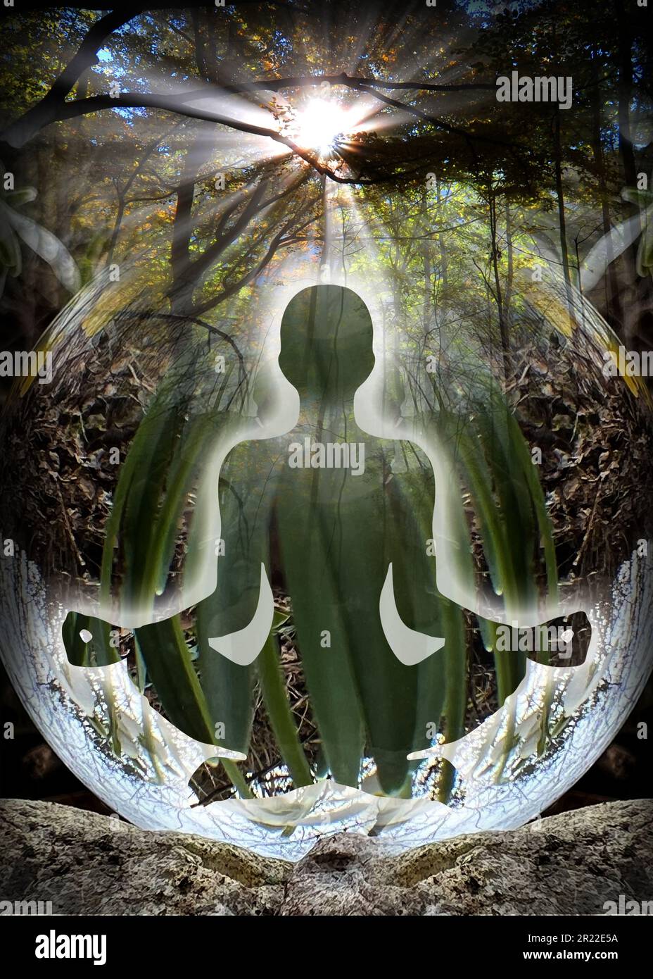 Human silhouette in yoga, lotus pose (human energy body, aura) in front of lensball (crystal ball) Stock Photo