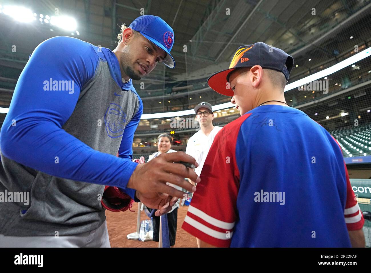 Chicago Cubs' Christopher Morel, left, signs an autograph during ...