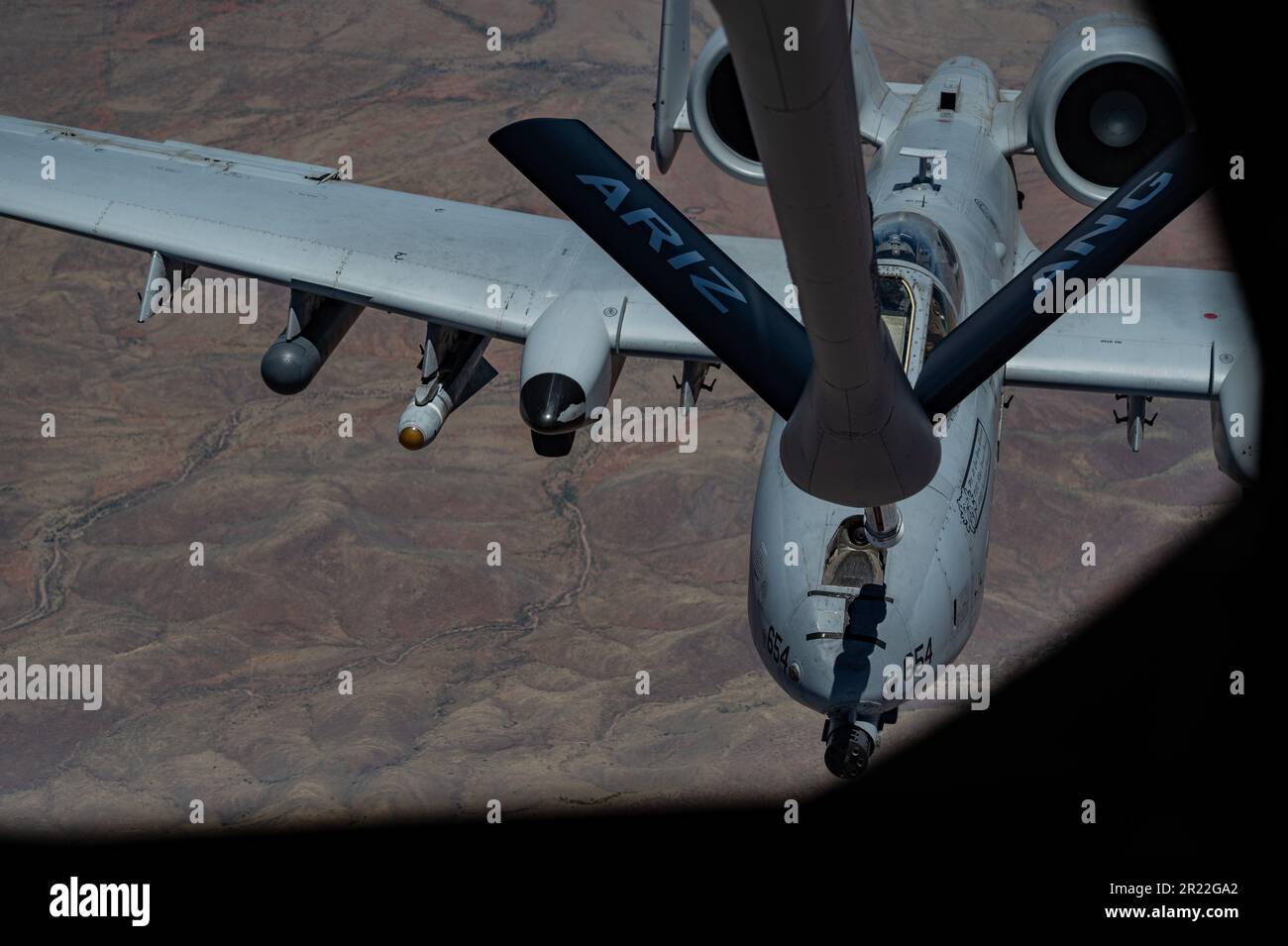 A U.S. Air Force A-10 Thunderbolt II approaches the boom from a KC-135 Stratotanker over Arizona, May 11, 2023. The KC-135 Stratotanker flew over four hours to provide fuel to aircraft participating in Red-Flag Rescue 23-1. (U.S. Air Force photo by Airman 1st Class Jhade Herrera) Stock Photo