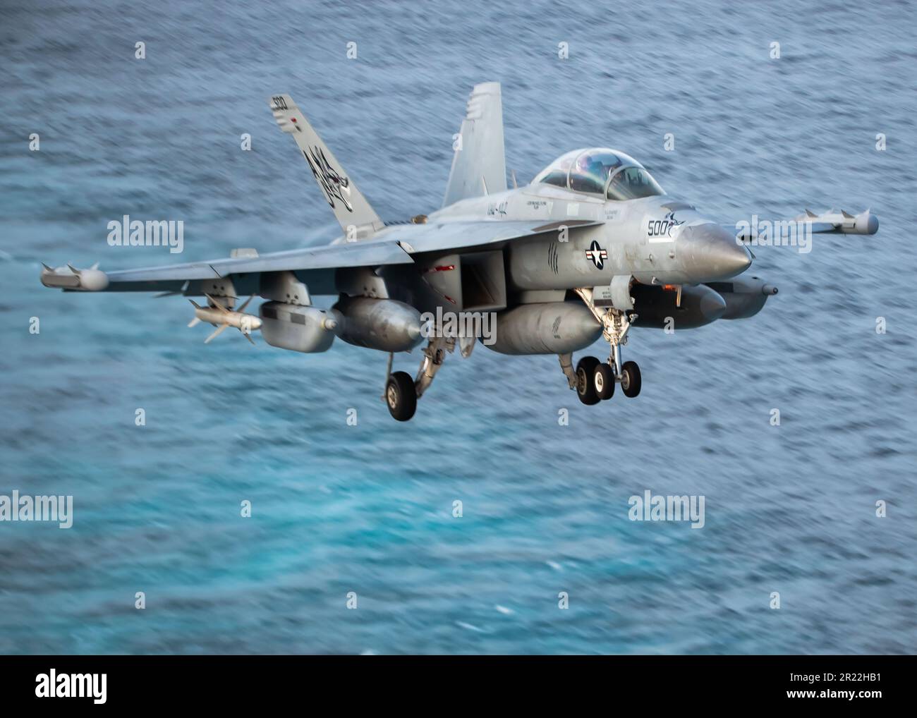 An E/A-18G Growler, attached to the 'Gray Wolves' of Electronic Attack Squadron (VAQ) 142 prepares to land on the first-in-class aircraft carrier USS Gerald R. FordÕs (CVN 78) flight deck, May 14, 2023. VAQ 142 is deployed aboard CVN 78 as part of Carrier Air Wing (CVW) 8. Gerald R. Ford is the U.S. NavyÕs newest and most advanced aircraft carrier, representing a generational leap in the U.S. NavyÕs capacity to project power on a global scale. The Gerald R. Ford Carrier Strike Group is on a scheduled deployment in the U.S. Naval Forces Europe area of operations, employed by U.S. Sixth Fleet to Stock Photo