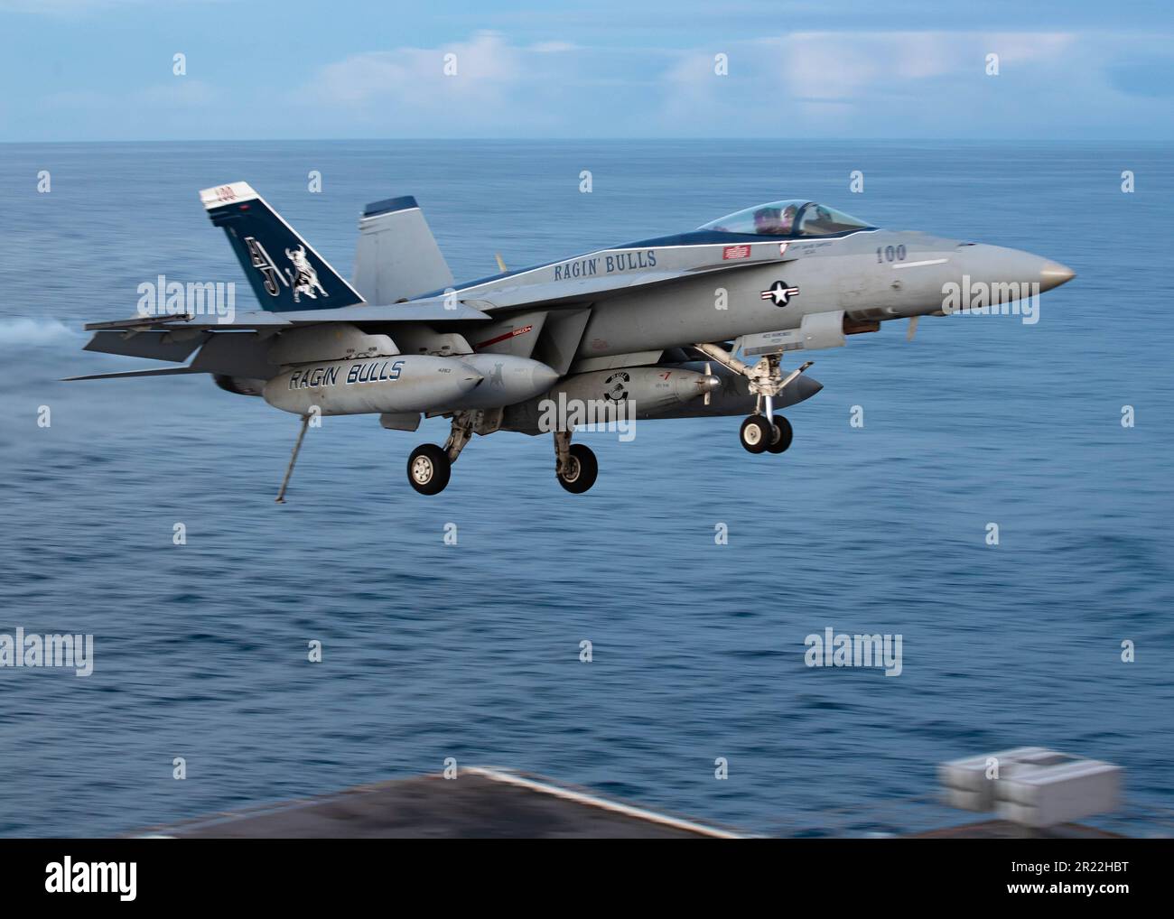 An F/A-18E Super Hornet, attached to the 'Ragin' Bulls' of Strike Fighter Squadron (VFA) 37 conducts a low pass above the first-in-class aircraft carrier USS Gerald R. FordÕs (CVN 78) flight deck, May 14, 2023. VFA 37 is deployed aboard CVN 78 as part of Carrier Air Wing (CVW) 8. Gerald R. Ford is the U.S. NavyÕs newest and most advanced aircraft carrier, representing a generational leap in the U.S. NavyÕs capacity to project power on a global scale. The Gerald R. Ford Carrier Strike Group is on a scheduled deployment in the U.S. Naval Forces Europe area of operations, employed by U.S. Sixth F Stock Photo