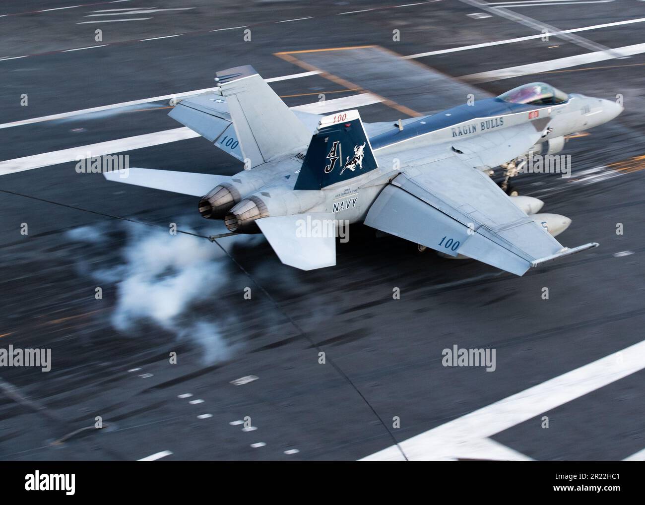 An F/A-18E Super Hornet, attached to the 'Ragin' Bulls' of Strike Fighter Squadron (VFA) 37 lands on the first-in-class aircraft carrier USS Gerald R. FordÕs (CVN 78) flight deck, May 14, 2023. VFA 37 is deployed aboard CVN 78 as part of Carrier Air Wing (CVW) 8. Gerald R. Ford is the U.S. NavyÕs newest and most advanced aircraft carrier, representing a generational leap in the U.S. NavyÕs capacity to project power on a global scale. The Gerald R. Ford Carrier Strike Group is on a scheduled deployment in the U.S. Naval Forces Europe area of operations, employed by U.S. Sixth Fleet to defend U. Stock Photo