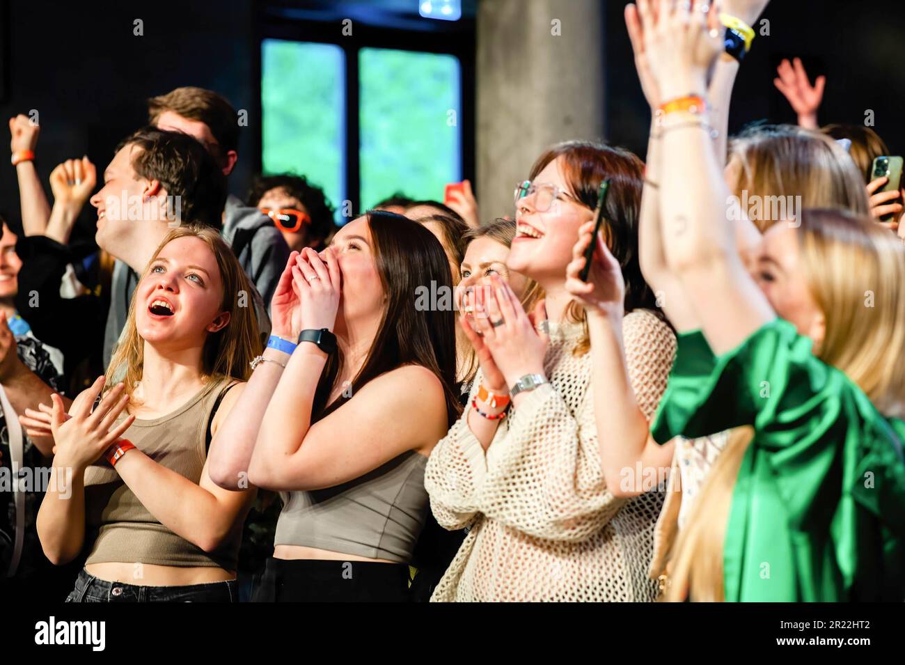 Breda, Netherlands, 15/05/2023, Fans cheer as the Ukrainian band GO A performs during the night termed 'support each other'. The Ukrainian band GO A, played exclusively for Ukrainian students at Breda University of Applied Sciences. The band wanted to bring the Ukrainian students together during the night to support each other. During the event, there was a voluntary collection of funds for the support of Ukraine, all donated to the 'Sails of Freedom' Foundation in the Netherlands. The charity performance was possible with the support of the rector of Breda University of Applied Sciences and t Stock Photo