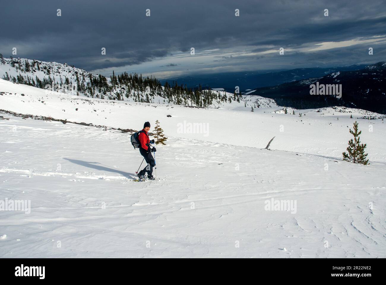 Adult woman snowshoeing on Mount Saint Helens, Washington Stock Photo