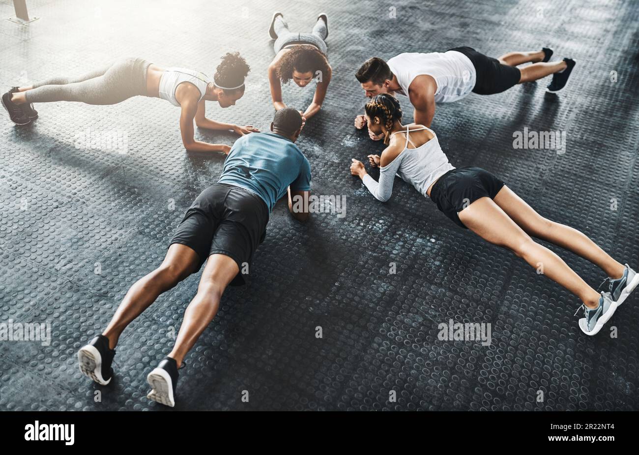 Planking is a full body experience. a group of young people doing