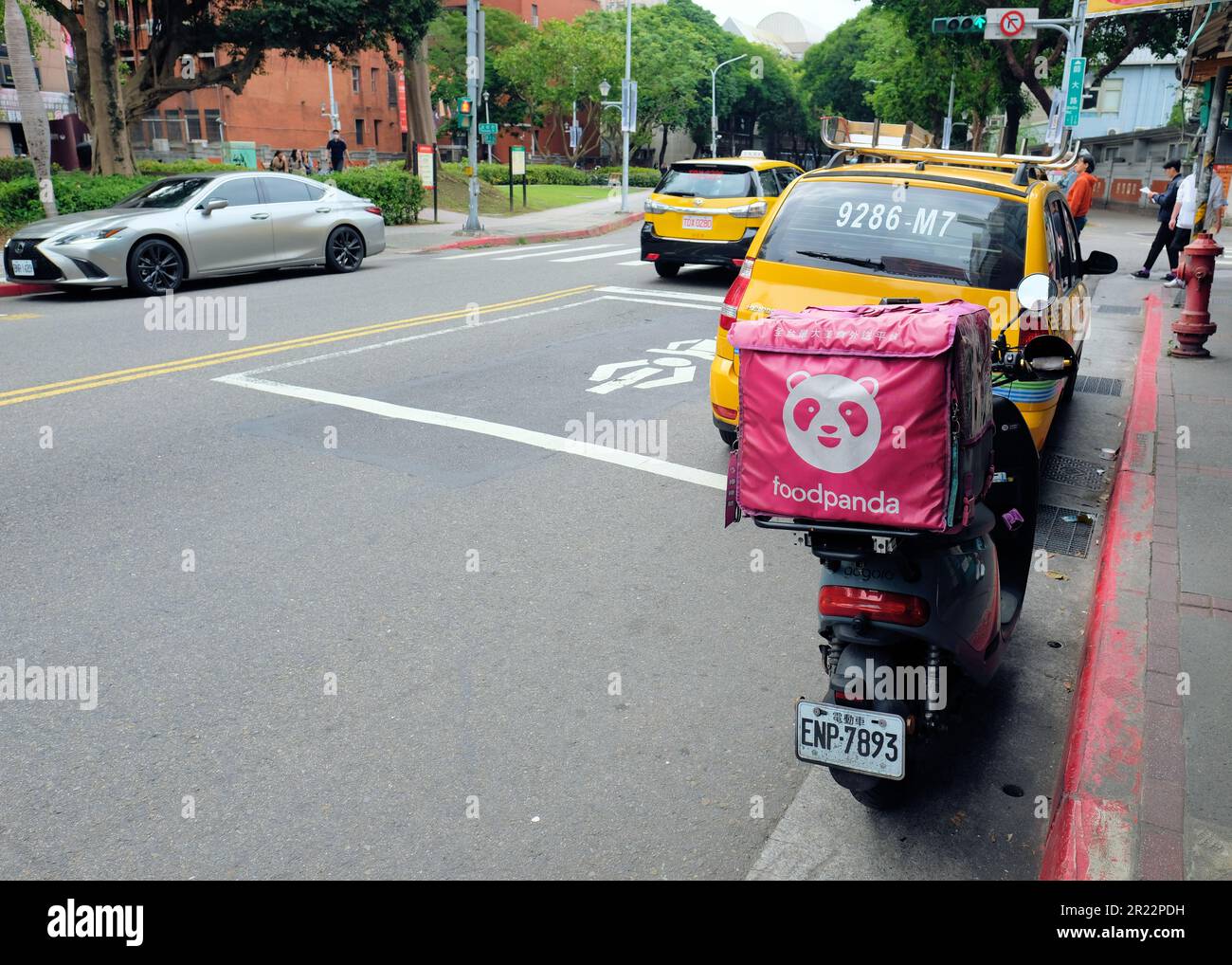 Food Panda meal delivery service scooter on the streets of Taipei