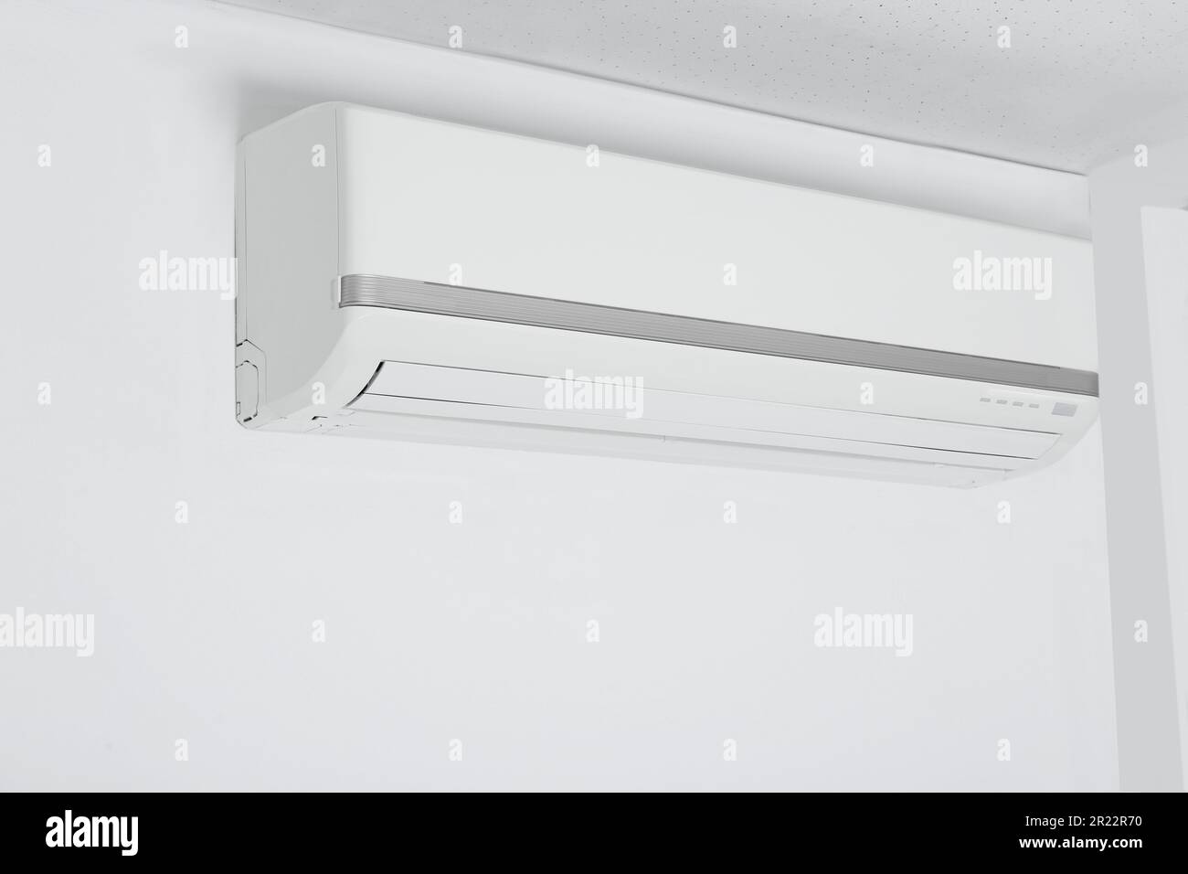 Modern air conditioner hanging on white wall Stock Photo Alamy