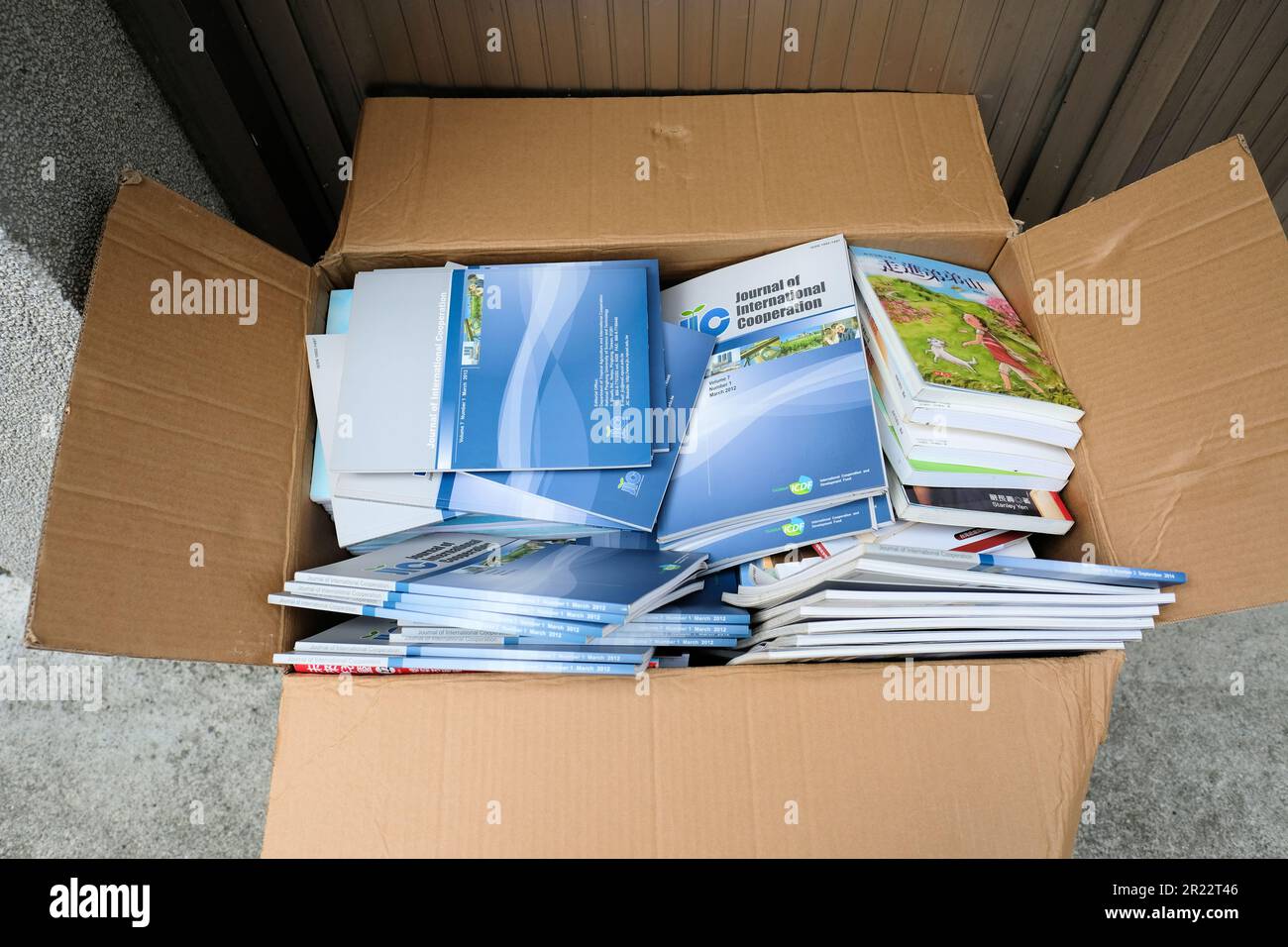 Discarded copies of The Journal of International Cooperation, a scientific journal published by the Taiwan International Cooperation Alliance, Taipei. Stock Photo