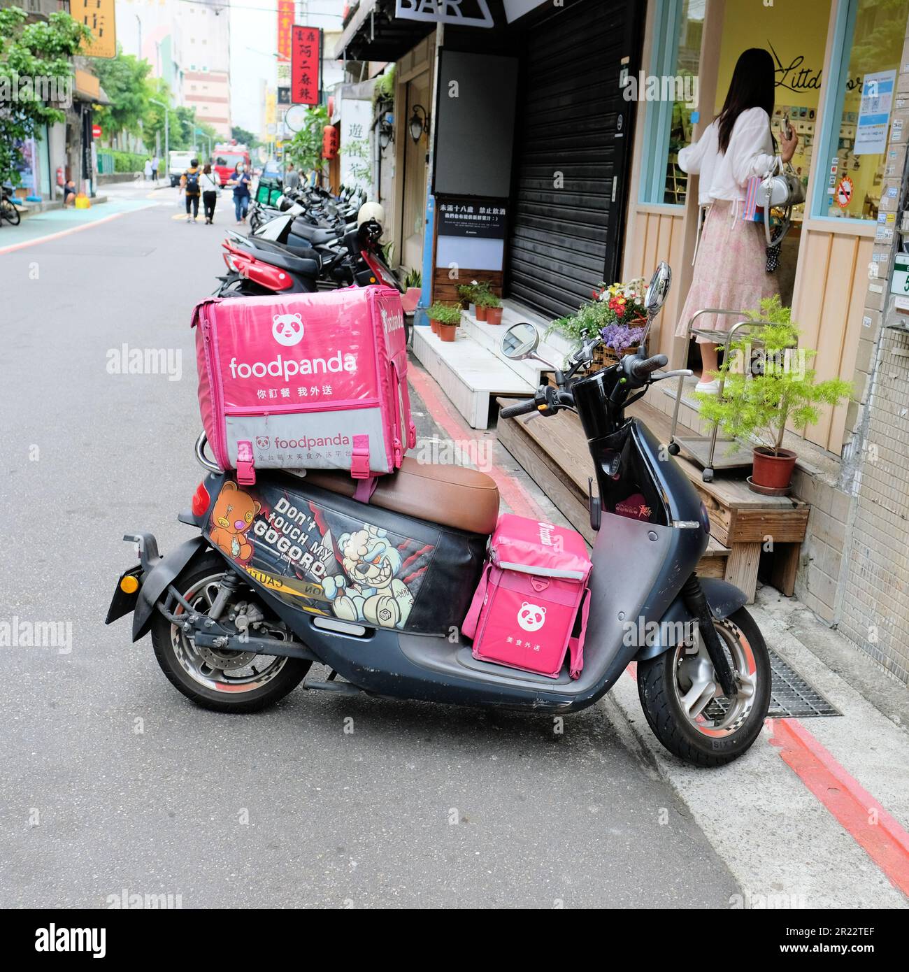 Food Panda meal delivery service scooter on the streets of Taipei