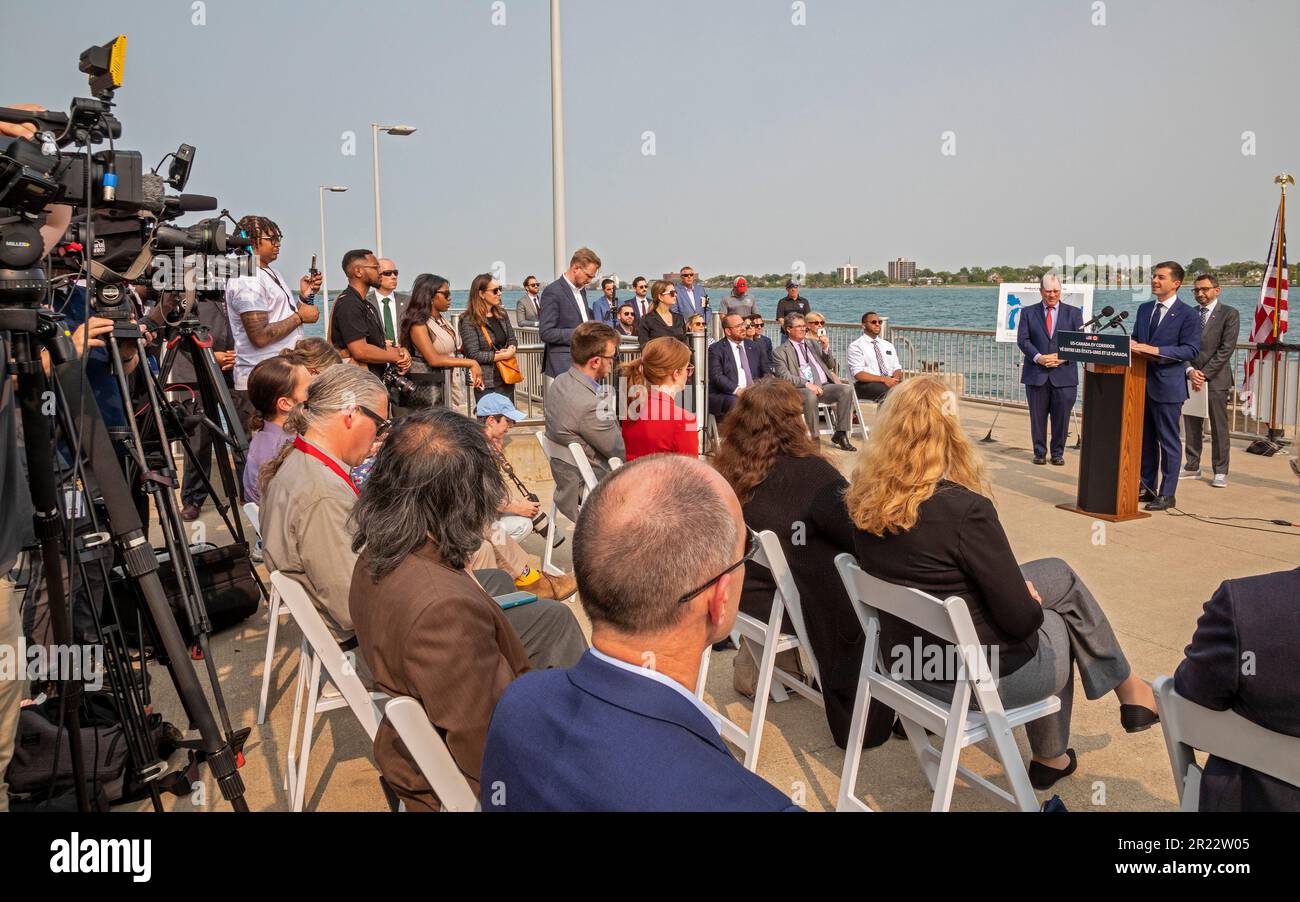 Detroit, Michigan, USA. 16th May, 2023. The United States and Canada announced plans for a binational electric vehicle corridor, with DC fast charging stations every 50 miles from Kalamazoo, Michigan to Quebec City, Quebec. Making the announcement at a dock on the Detroit River (with Canada across the river) were U.S. Transportation Secretary Pete Buttigieg and Canadian Minister of Transport Omar Alghabra, along with Detroit Mayor Mike Duggan. Credit: Jim West/Alamy Live News Stock Photo