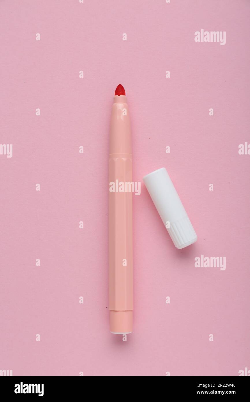 Bright marker and cap on light pink background, flat lay Stock Photo ...