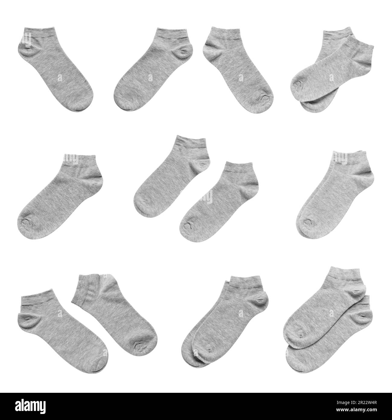 Set with grey socks on white background Stock Photo - Alamy