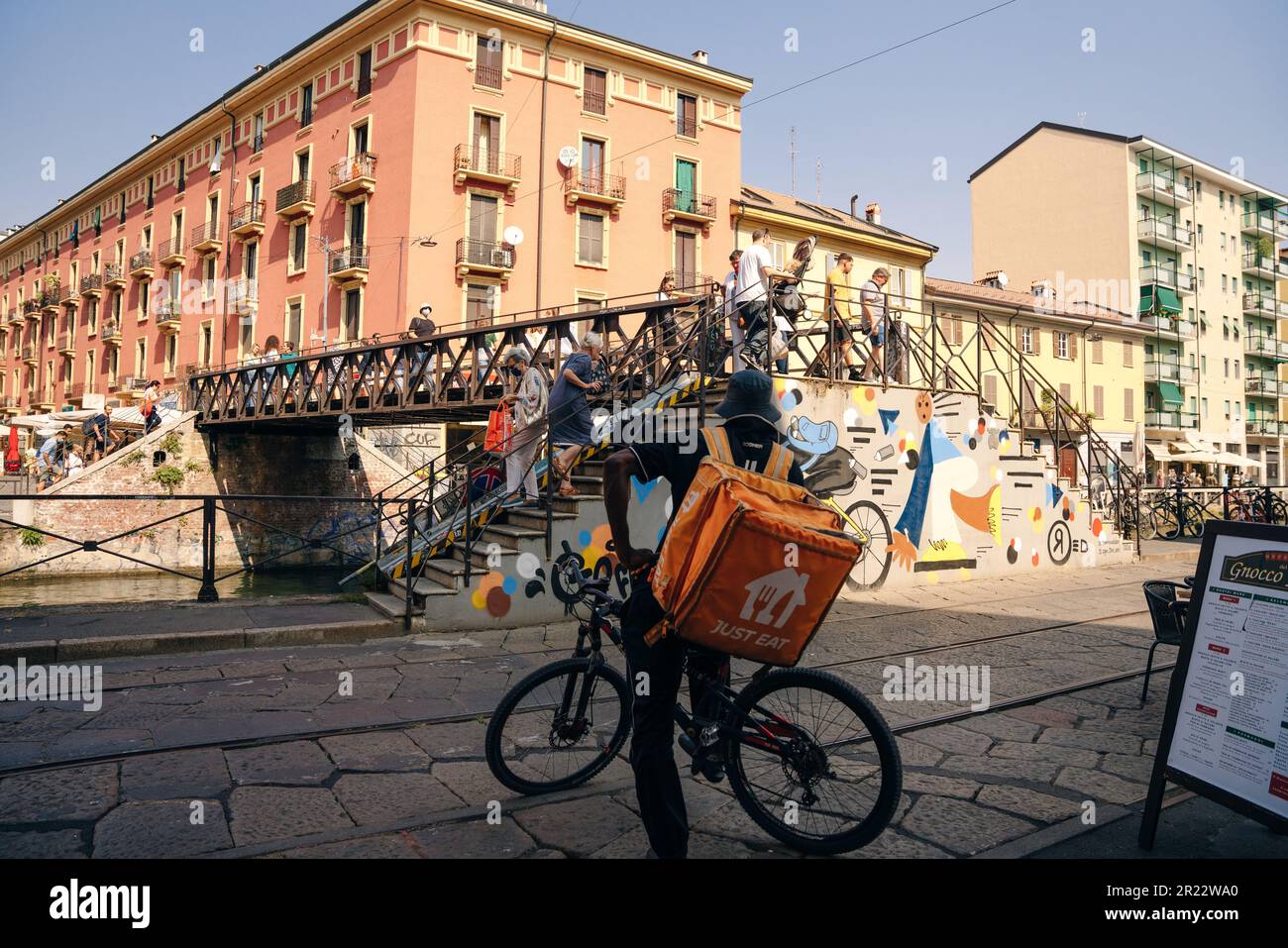 food delivery man in milan, italy. High quality photo Stock Photo Alamy
