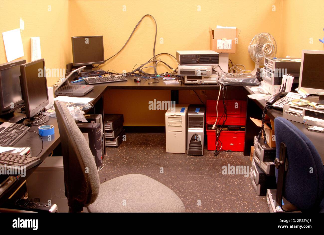 Quite messy computer and PC repair room Stock Photo - Alamy