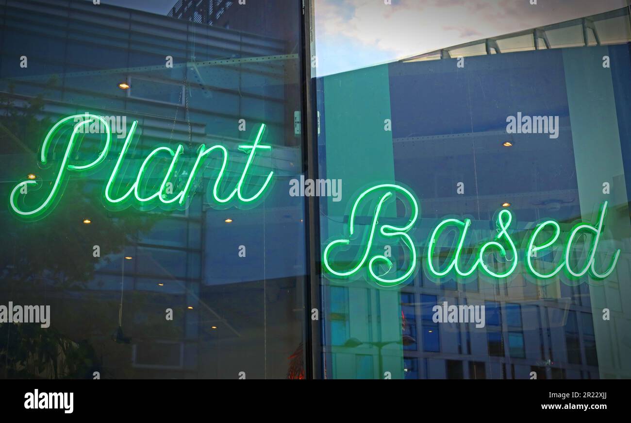 Green neon sign in Vegetarian restaurant, Liverpool - Plant Based Stock Photo