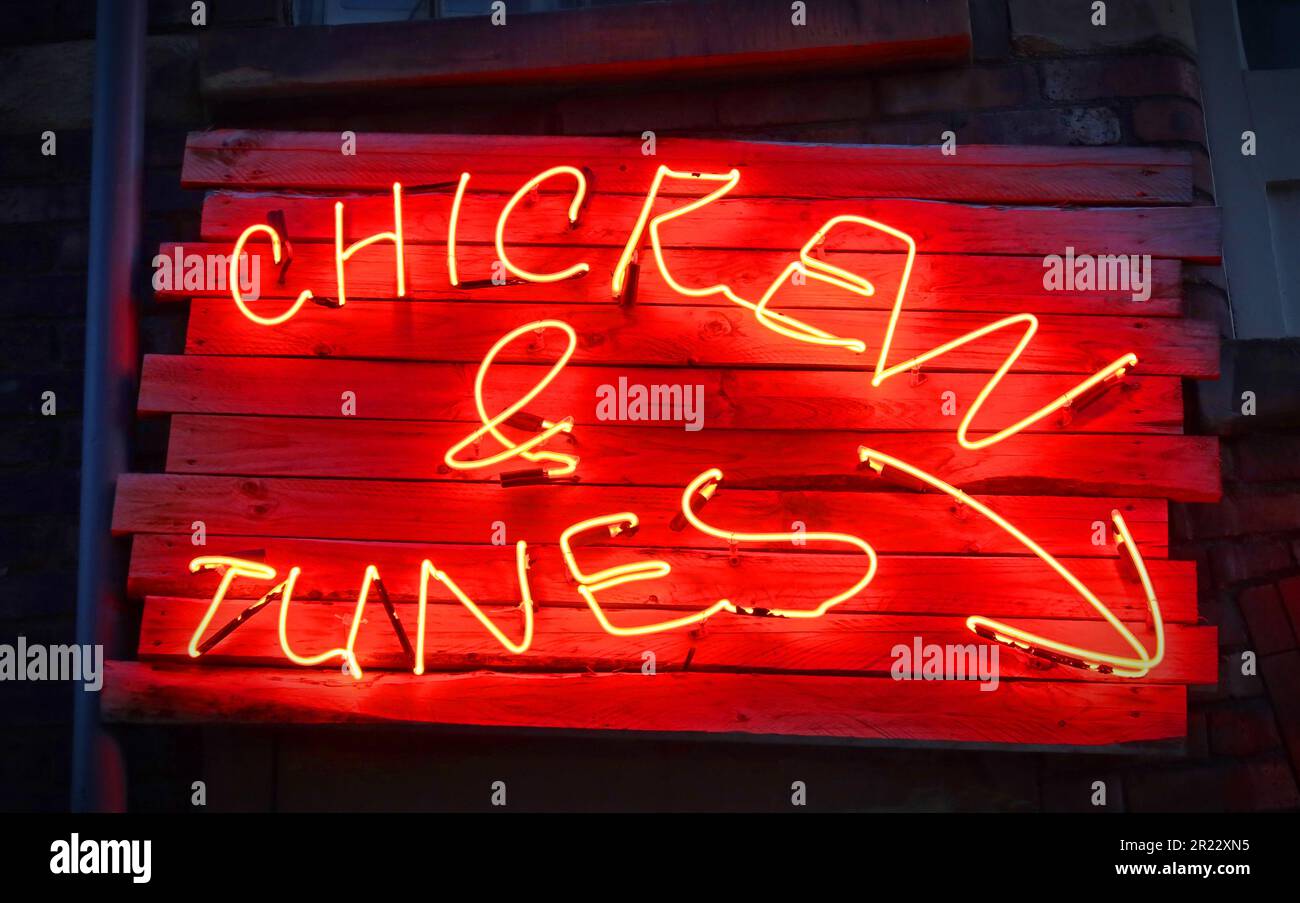 Red Neon sign at Chicken & Tunes, Pattersons, 28 Gradwell St, Liverpool, Merseyside, England, UK,  L1 4JH Stock Photo