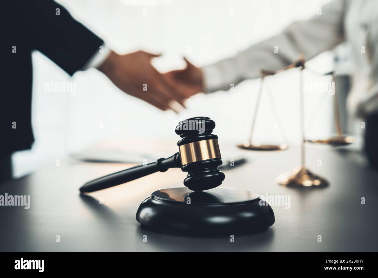 Focus gavel symbolize justice on blur background of lawyer colleagues