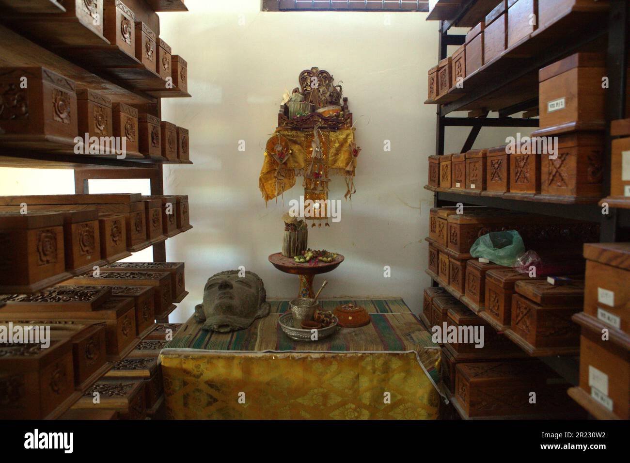 A storage room where wooden boxes containing old Balinese lontarleaf