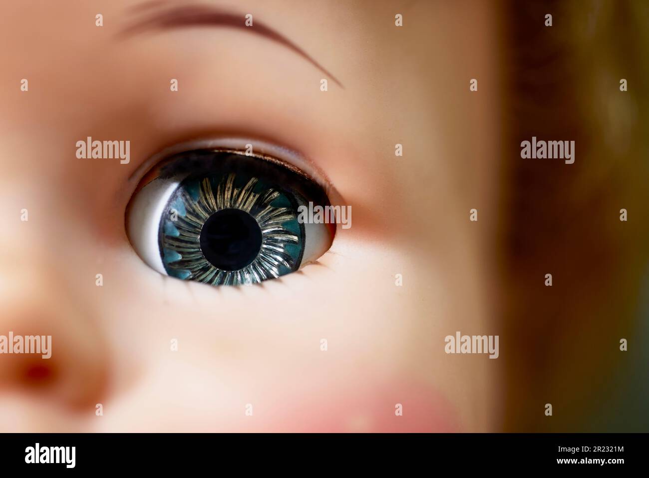 Close up of the Eye of a Vintage Doll with shallow depth of field Stock Photo