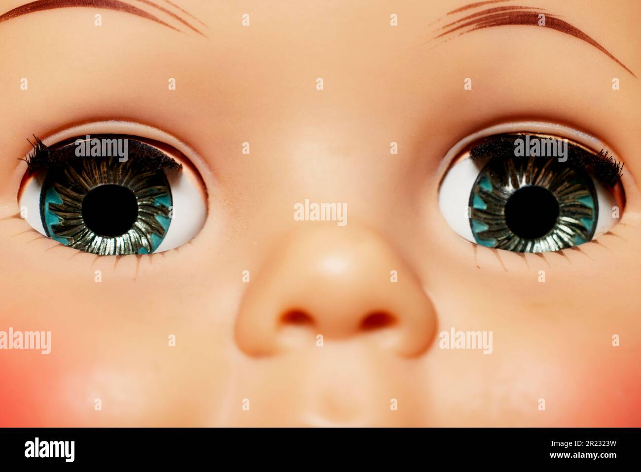 Close up of the Eyes of a Vintage Doll with shallow depth of field Stock Photo
