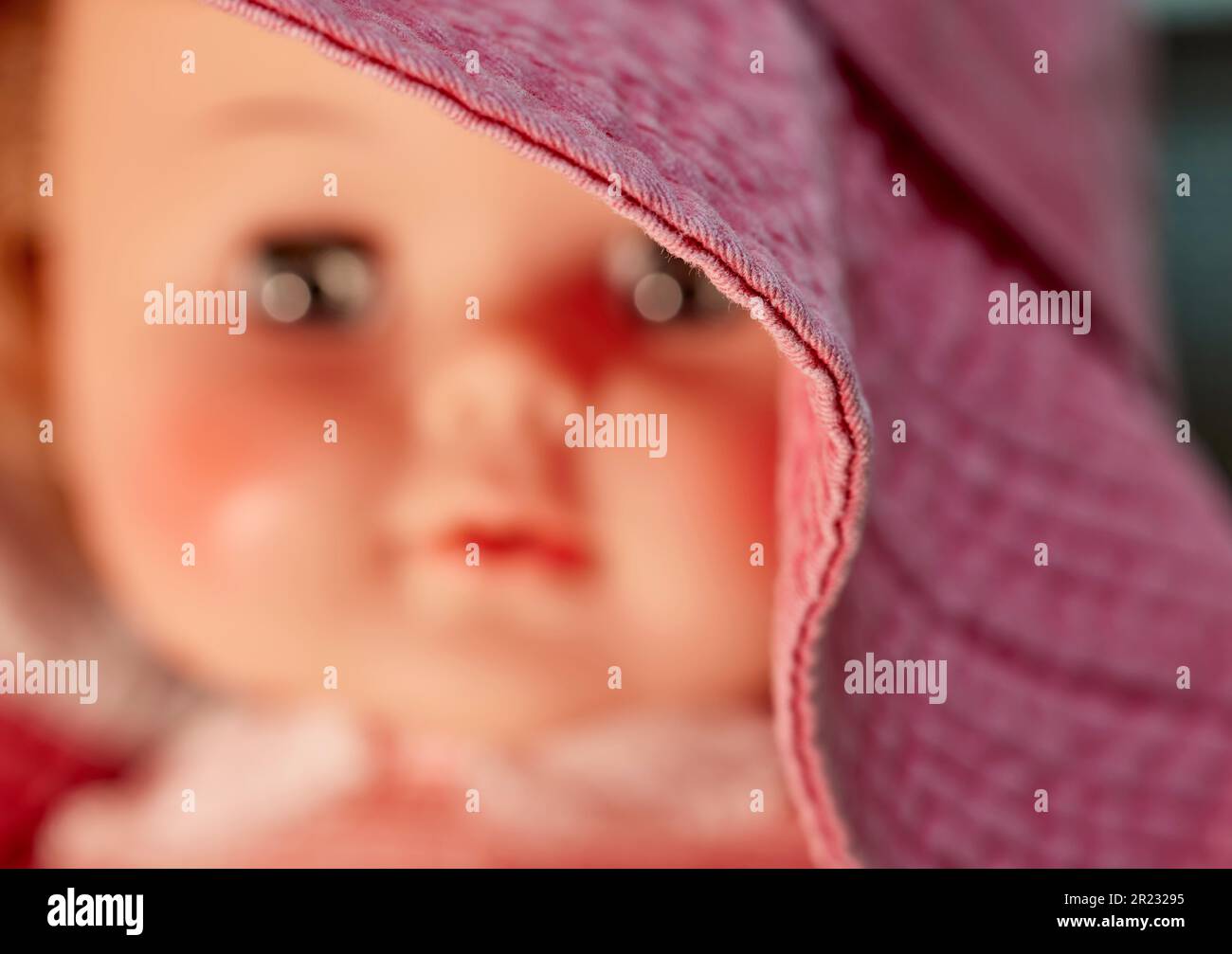 Close up of the rim of a hat on a Vintage Doll with shallow depth of field Stock Photo