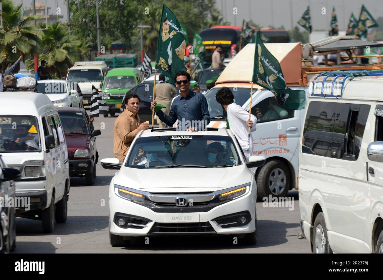May 15, 2023, Peshawar, Peshawar, Pakistan: Supporters of Islamic political party Jamiat Ulma-e-Islam, part of ruling coalition of Pakistan Democratic Movement (PDM) leave to join a protest outside the Supreme Court, following release of opposition party PTI head and former Prime Minister Imran Khan by courts. Pakistani opposition got a major relief on 11 May when the supreme court ordered the release of the former prime minister, Imran Khan, two days after his arrest. Khan was held by the paramilitary troopers on 09 May from a court complex in the capital, sparking violent protests with clash Stock Photo