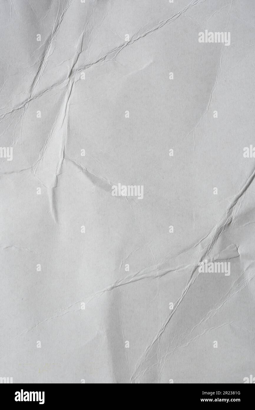 Crumpled gray cardstock paper texture background in vertical Stock