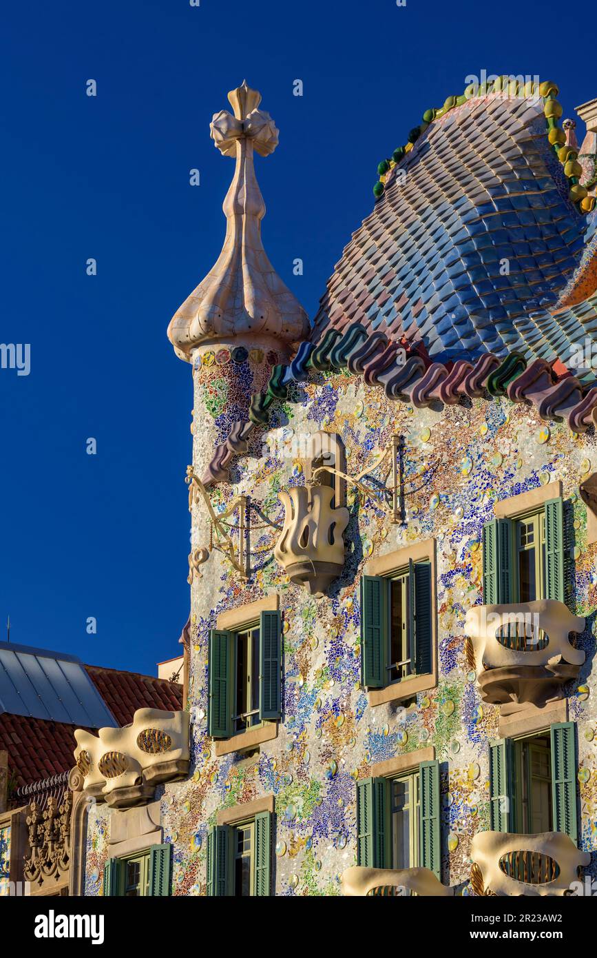 Casa Batlló with the morning light illuminating the façade and the trencadis mosaic designed by Antoni Gaudí (Barcelona, Catalonia, Spain) Stock Photo