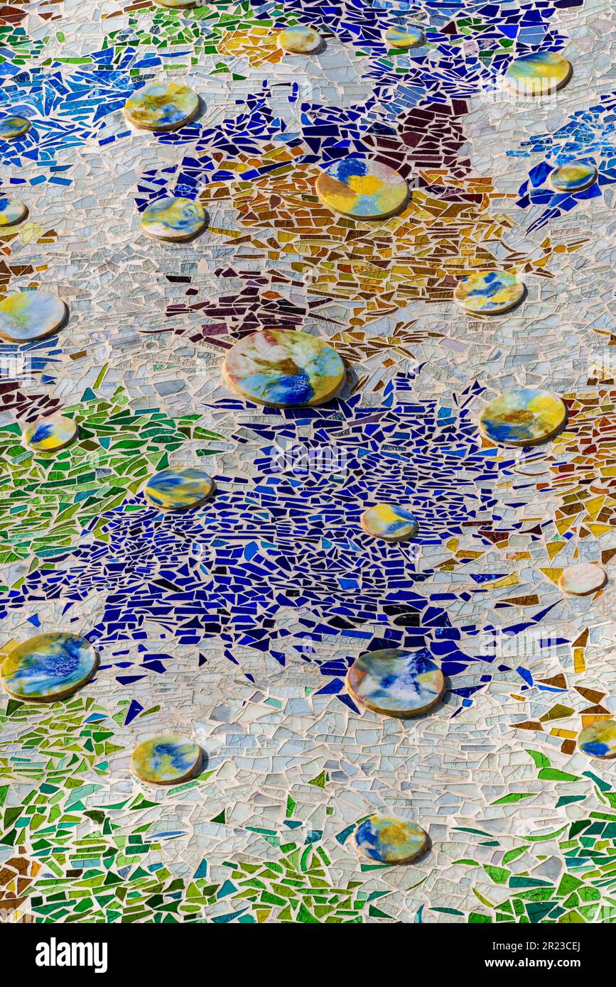 Detail of trencadis mosaic in the façade of the Casa Batlló which simulates a colored lake with water lilies, designed by Antoni Gaudí Barcelona Spain Stock Photo