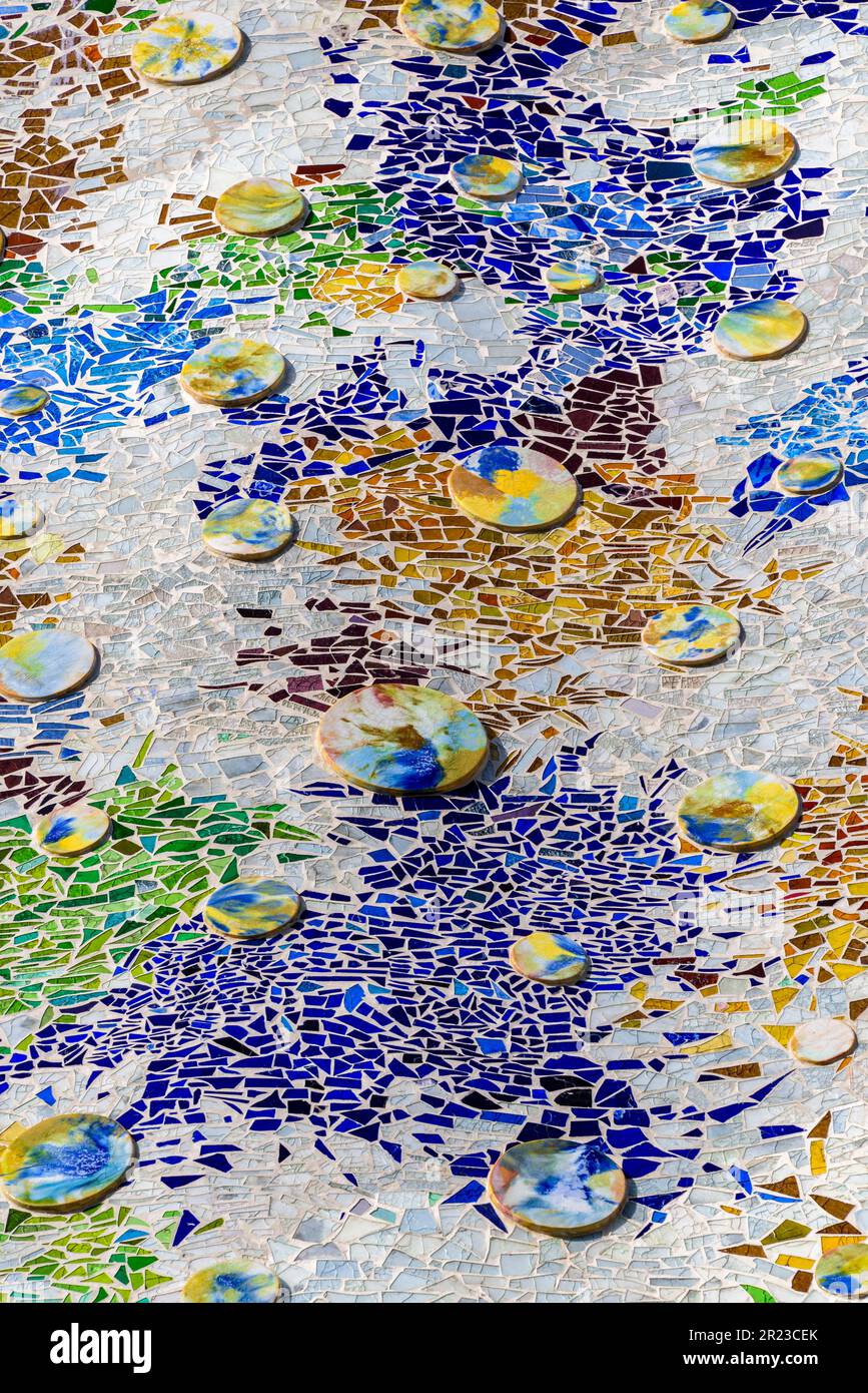 Detail of trencadis mosaic in the façade of the Casa Batlló which simulates a colored lake with water lilies, designed by Antoni Gaudí Barcelona Spain Stock Photo