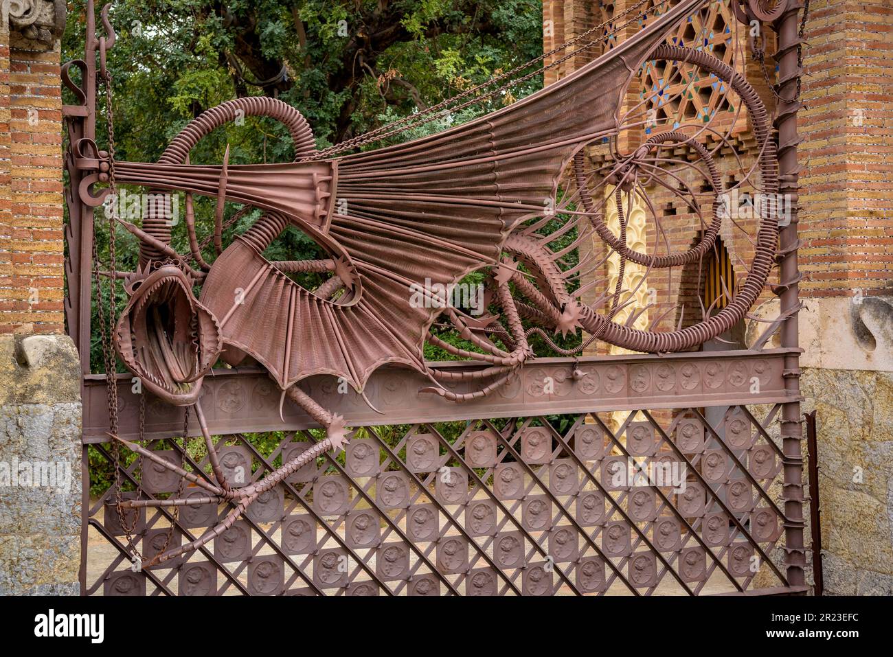 Wrought iron fence in the Güell Pavilions, a work by Gaudí, with the dragon that represents the guardian of the Garden of the Hesperides (Barcelona) Stock Photo