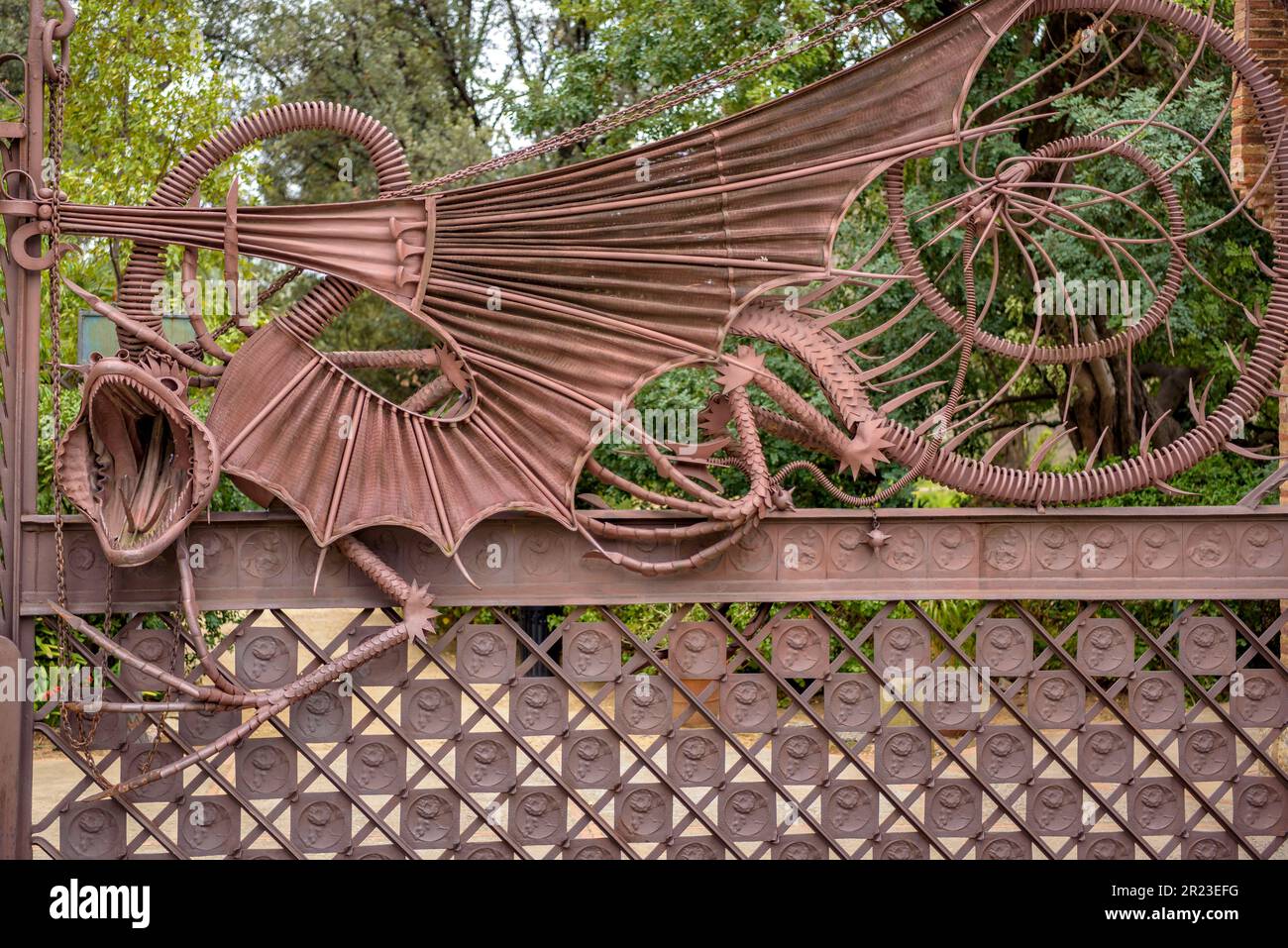 Wrought iron fence in the Güell Pavilions, a work by Gaudí, with the dragon that represents the guardian of the Garden of the Hesperides (Barcelona) Stock Photo