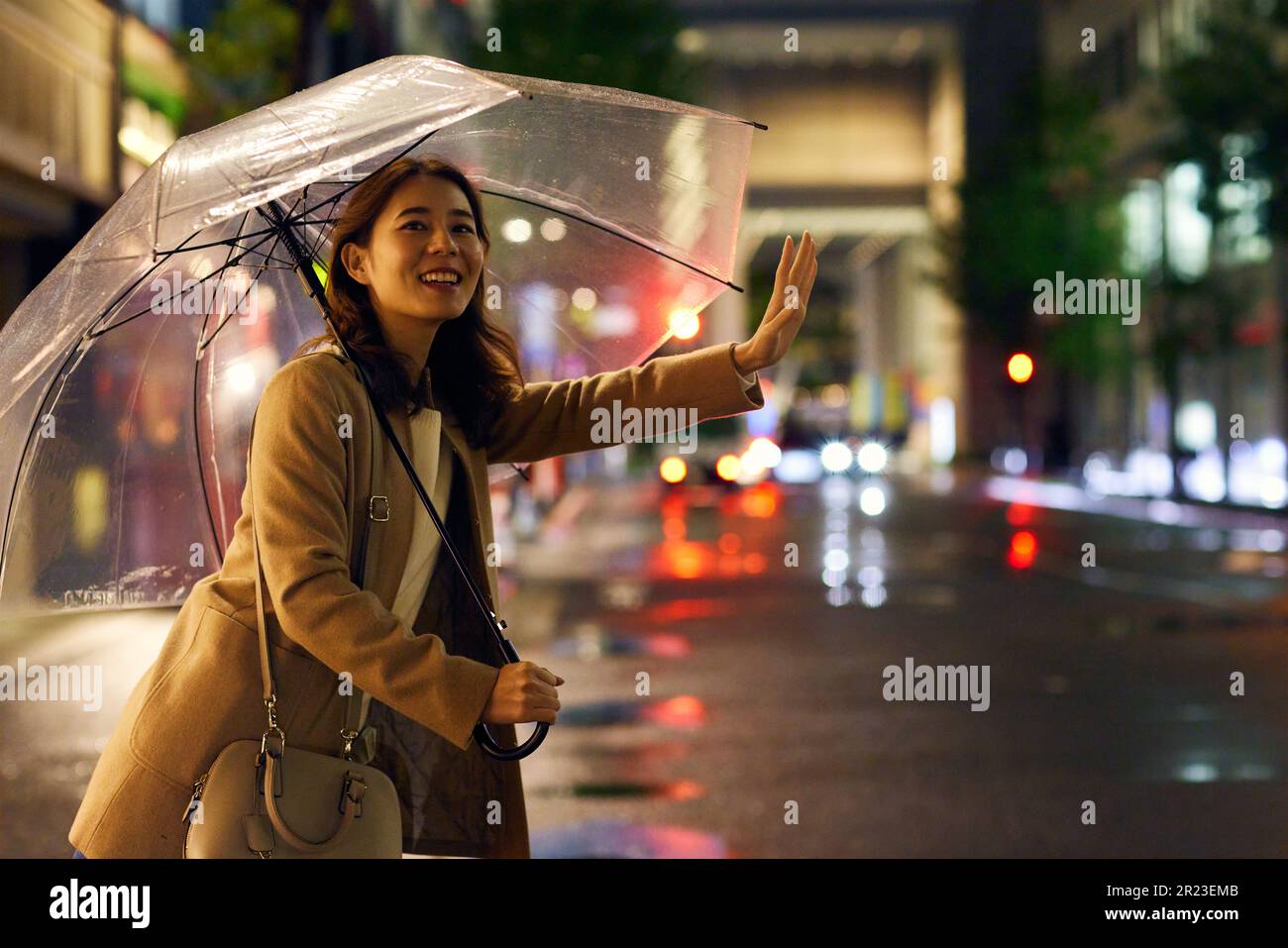 Japanese woman in the rain Stock Photo