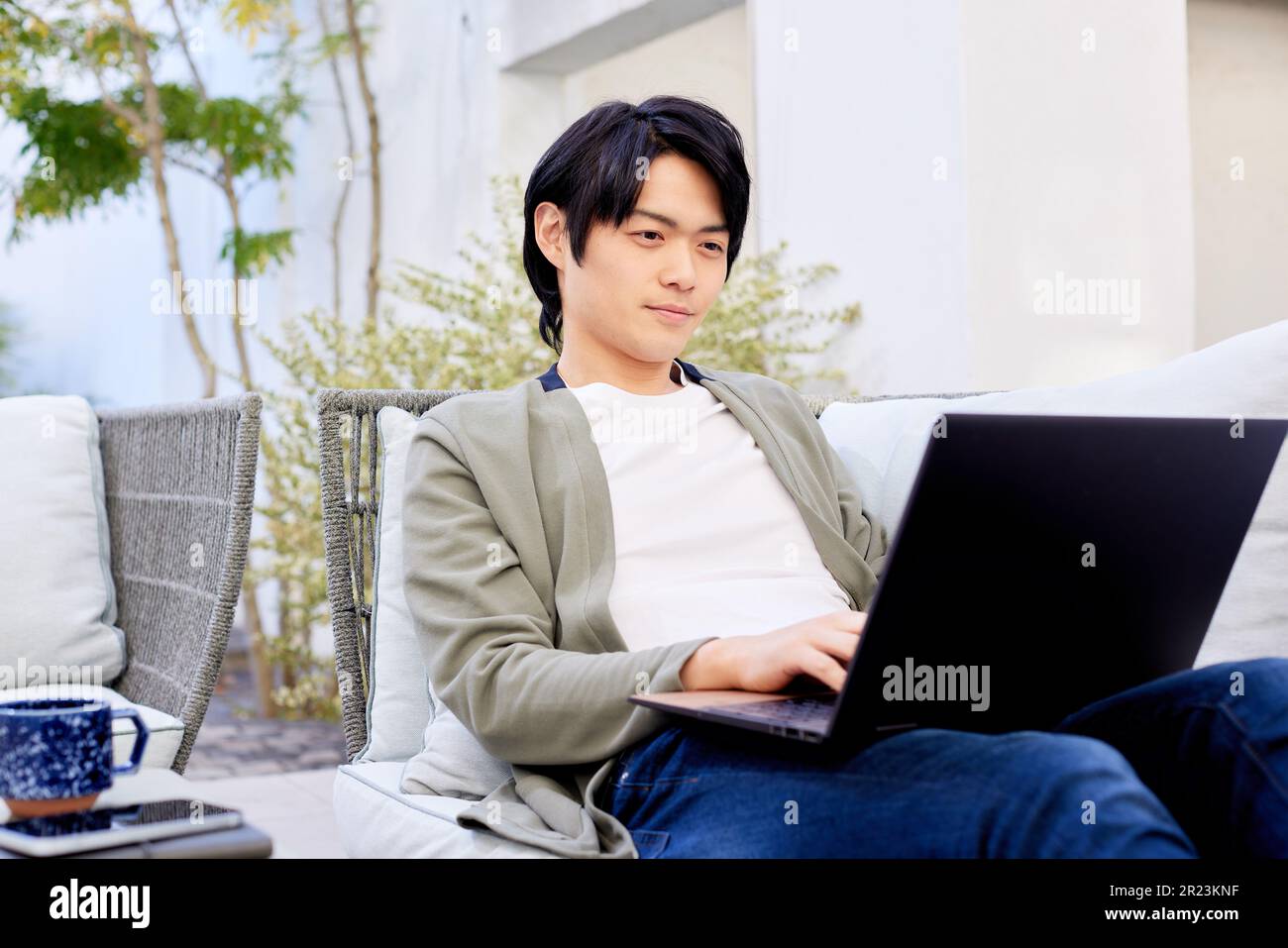 Japanese Man Using Computer Japanese man working on laptop Stock Photo - Alamy