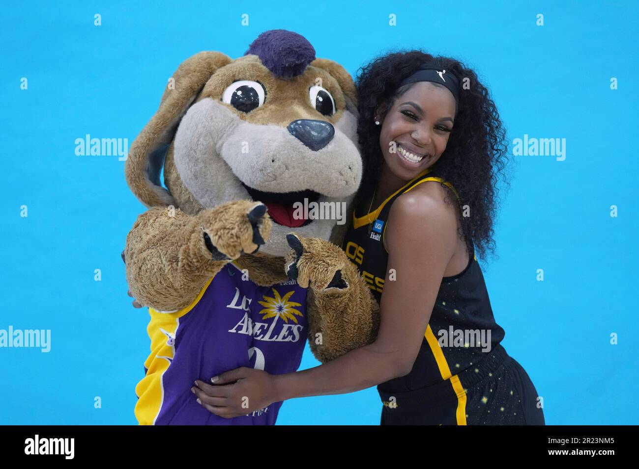LA Sparks forward Reshanda Gray (22) poses with mascot Sparky