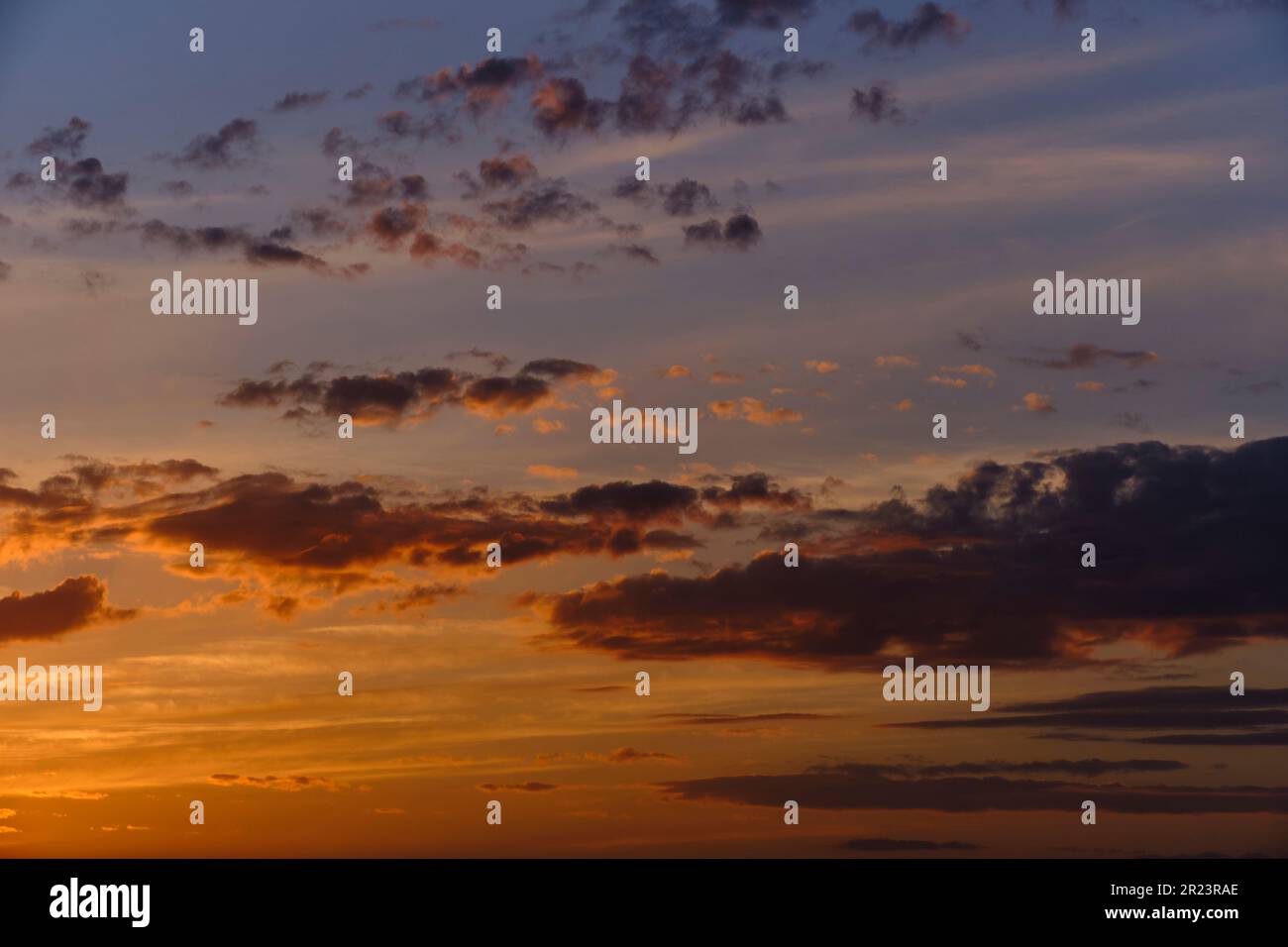 Clouds on a blue sky background during sunset Stock Photo