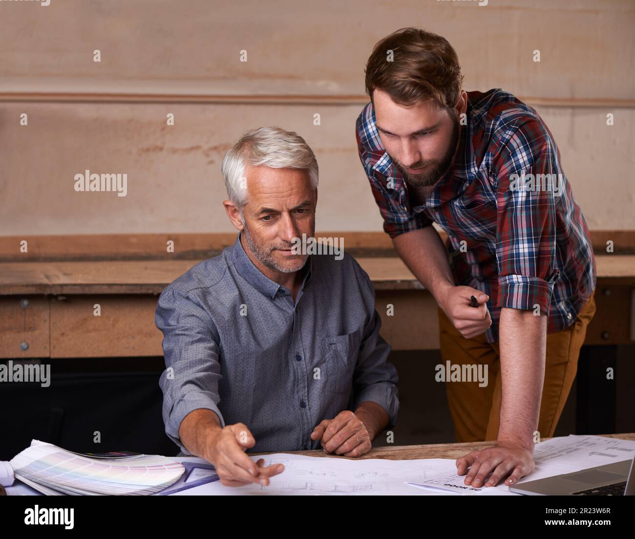 Turning his vision into reality. An architect drawing up plans Stock