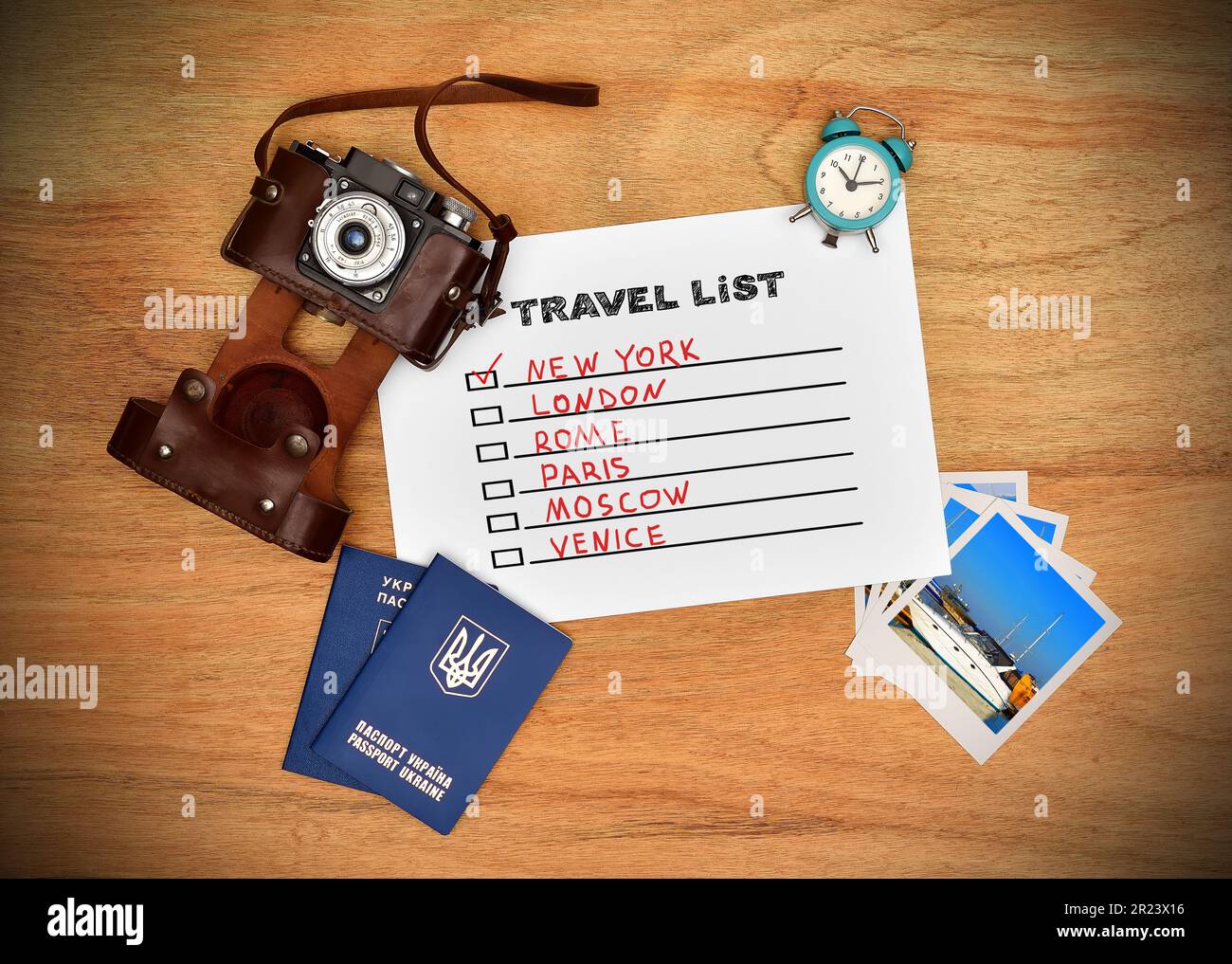 Toursit Paper Camera, passport, and paper with drawing travel list. Work desk tourist ...
