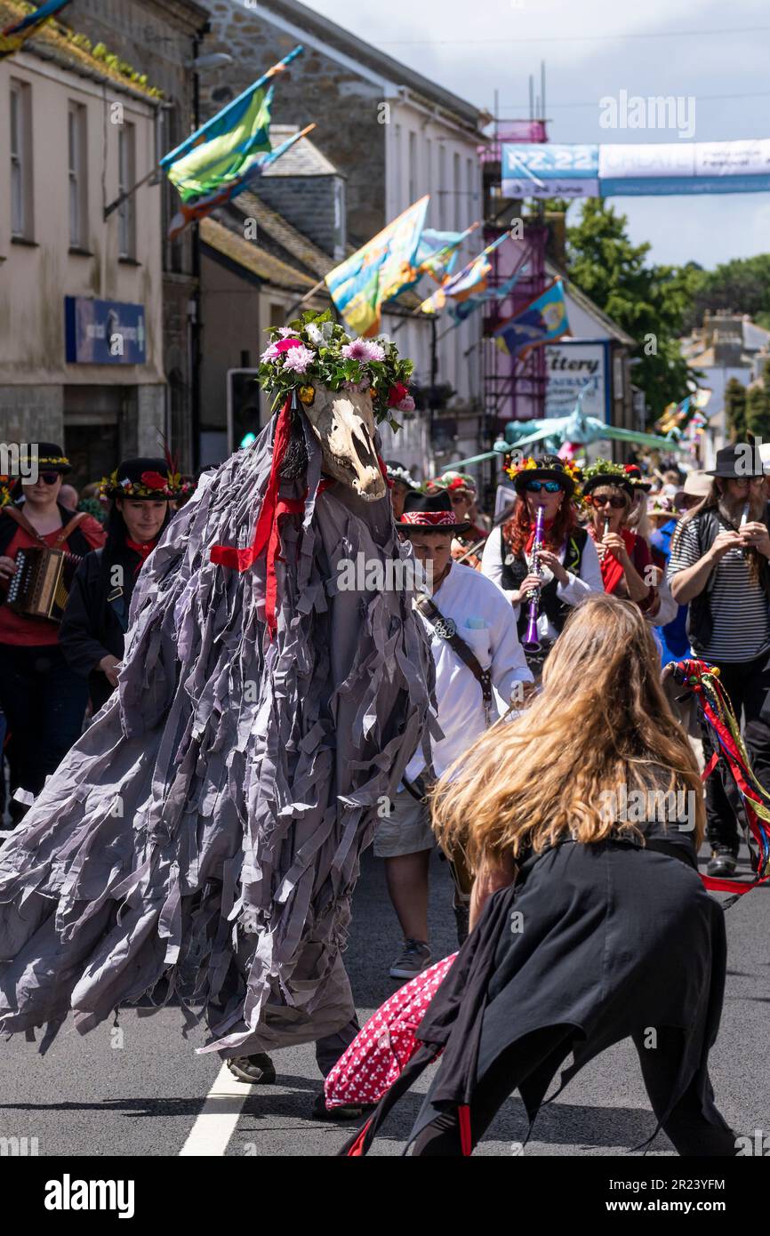 Penglaz the Penzance Obby Oss and the Teazer The Bucca with musicians of the Raffidy Dumitz Band leading the Civic Procession on Mazey Day during the Stock Photo