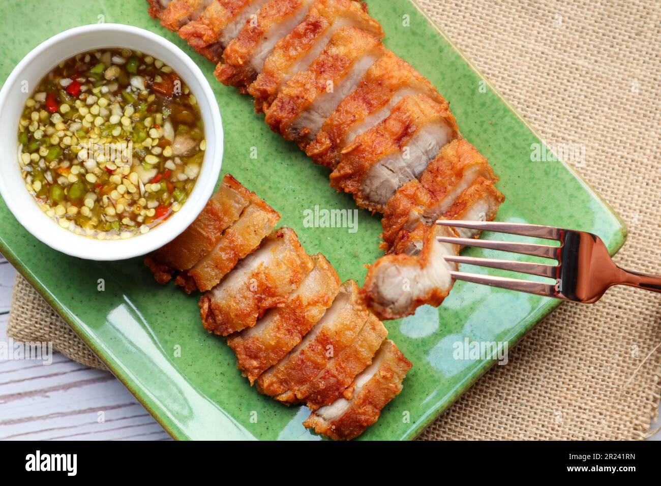 Deep fried pork belly with spicy sauce In Thai called Moo Tord at top