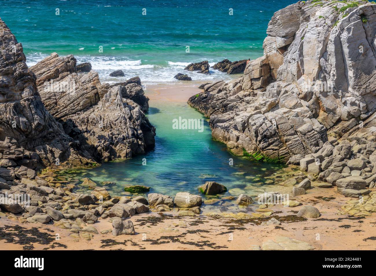Natural pool in the rocks on the West coast of Quiberon peninsula, Morbihan, Britanny, France Stock Photo